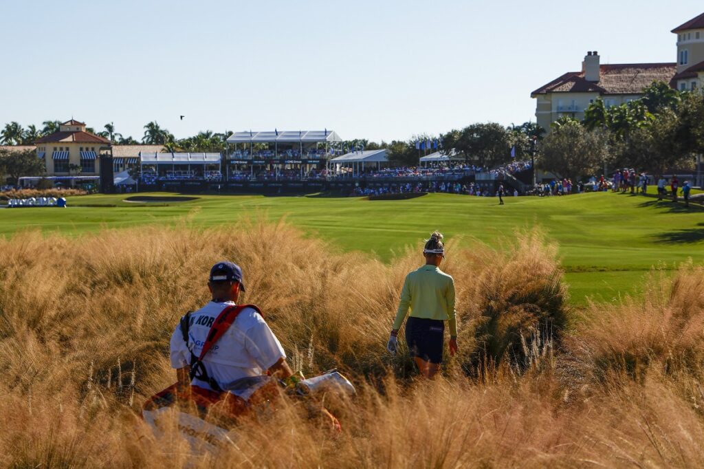 NAPLES, FLORIDA - NOVEMBER 19: Nelly Korda of the United States and caddie Jason McDede walk up the 18th fairway during the final round of the CME Group Tour Championship at Tiburon Golf Club on November 19, 2023 in Naples, Florida. (Photo by Douglas P. DeFelice/Getty Images)